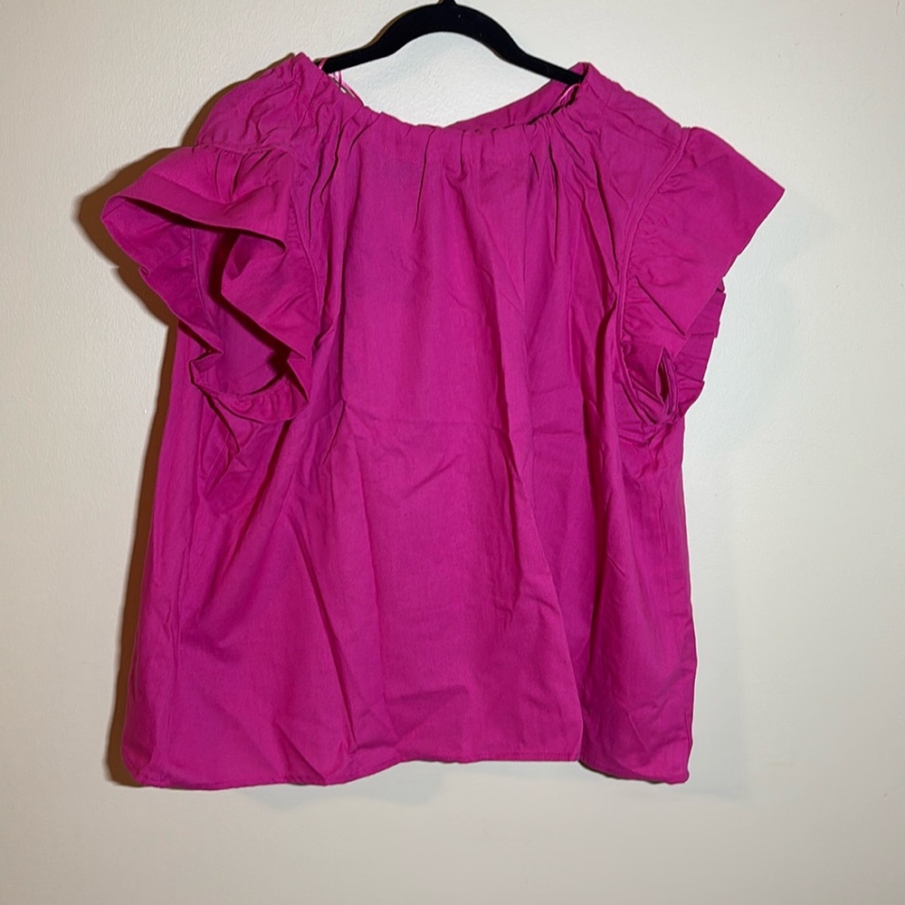 Pink linen top with ruffled cap sleeves